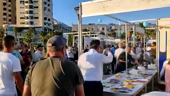 MEK agents attacking ASILA book stand