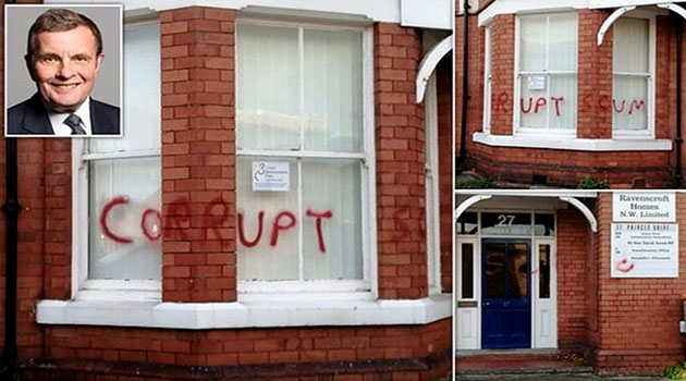 Protesters sprayed the words “corrupt scum” in red across the windows outside the David Jone office