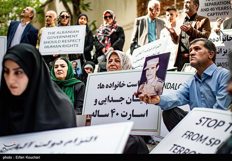 Nejat families sit in ,in front of the ICRC office in Tehran