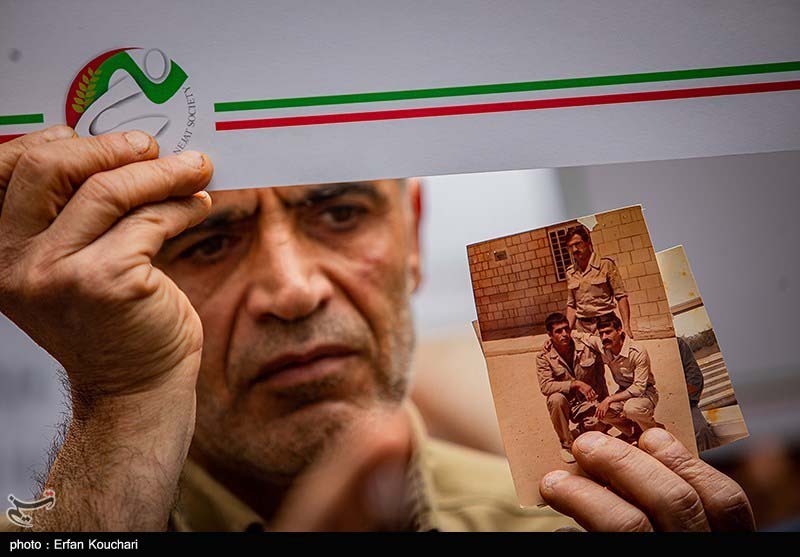 Nejat families sit in ,in front of the ICRC office in Tehran