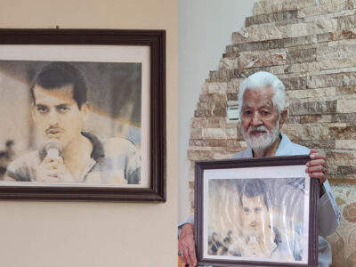 عکسی بر دیوار و عکسی در آغوش پدر