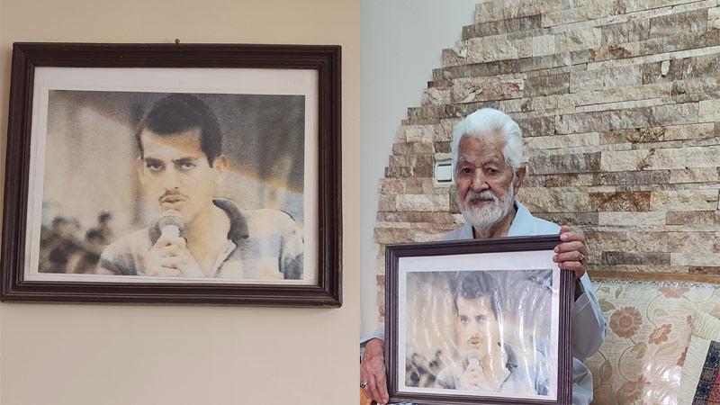 عکسی بر دیوار و عکسی در آغوش پدر